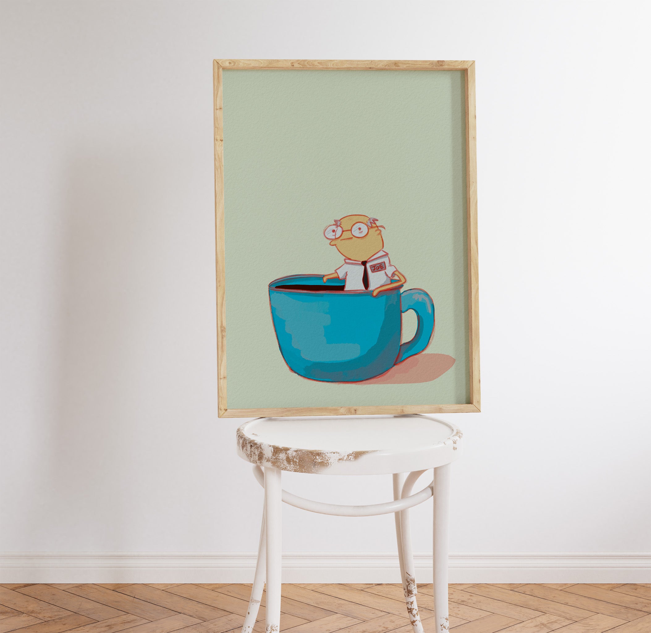 humorous coffee themed artwork is displayed on a white stool in a kitchen