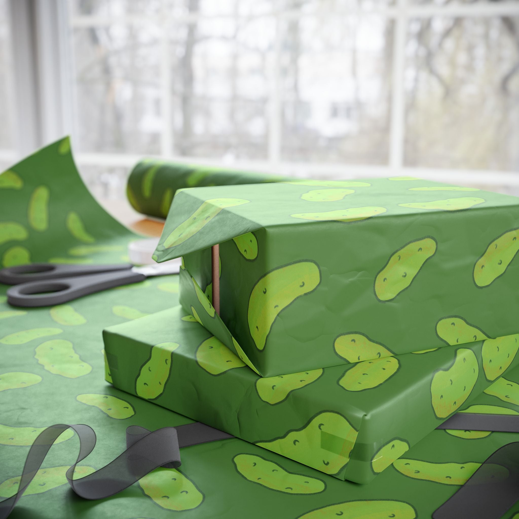 dill pickle wrapping paper that features a pattern of dill pickles over a dark green background is used to wrap several boxed gifts and is displayed by ribbon and scissors