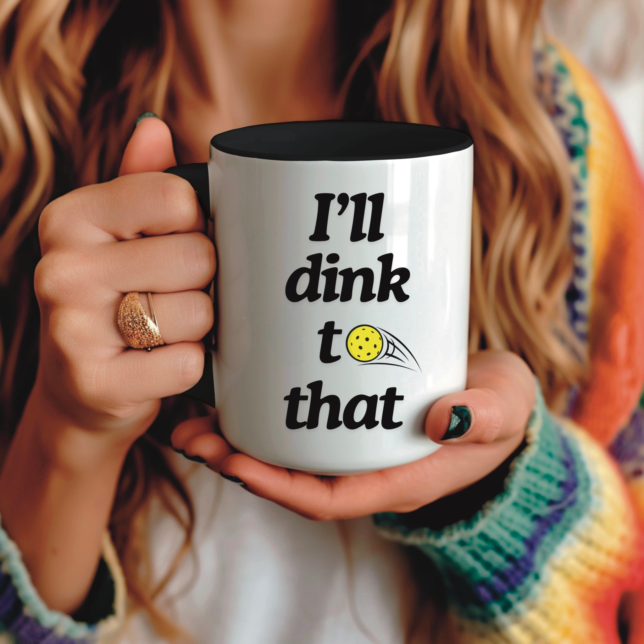 front view of pickle ball mug with black ceramic accents and funny pickle ball quote that says "I'll dink to that"