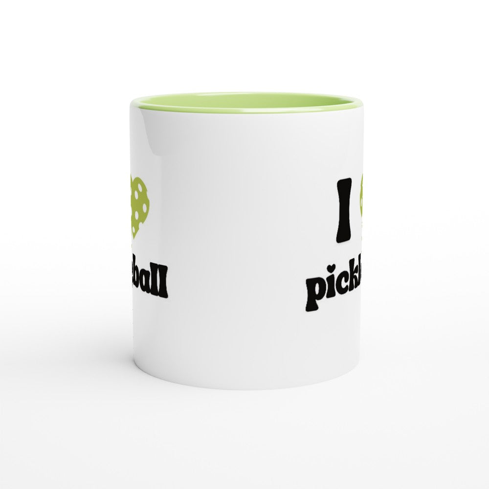 side view of a pickle ball mug with a quote that says "I heart Pickle ball" with green ceramic accents