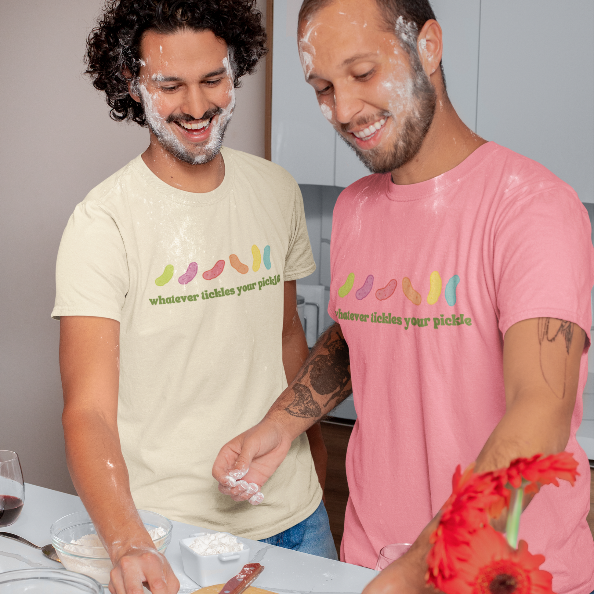 a gay couple baking together while wearing matching pickle themed pride shirts