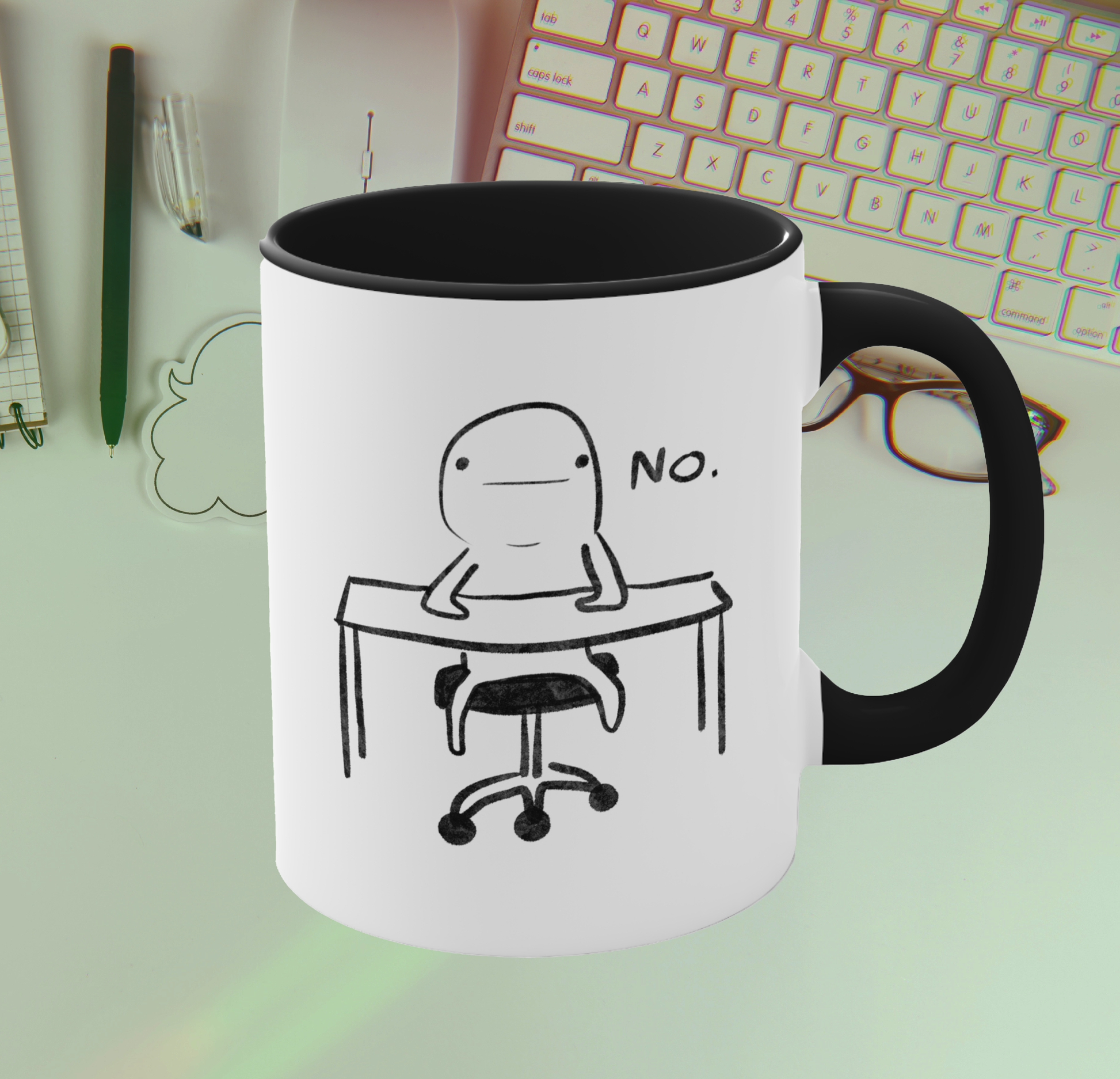 front view of white ceramic coffee mug with black handle and funny illustration of doodle person sitting at desk with the word "no" 