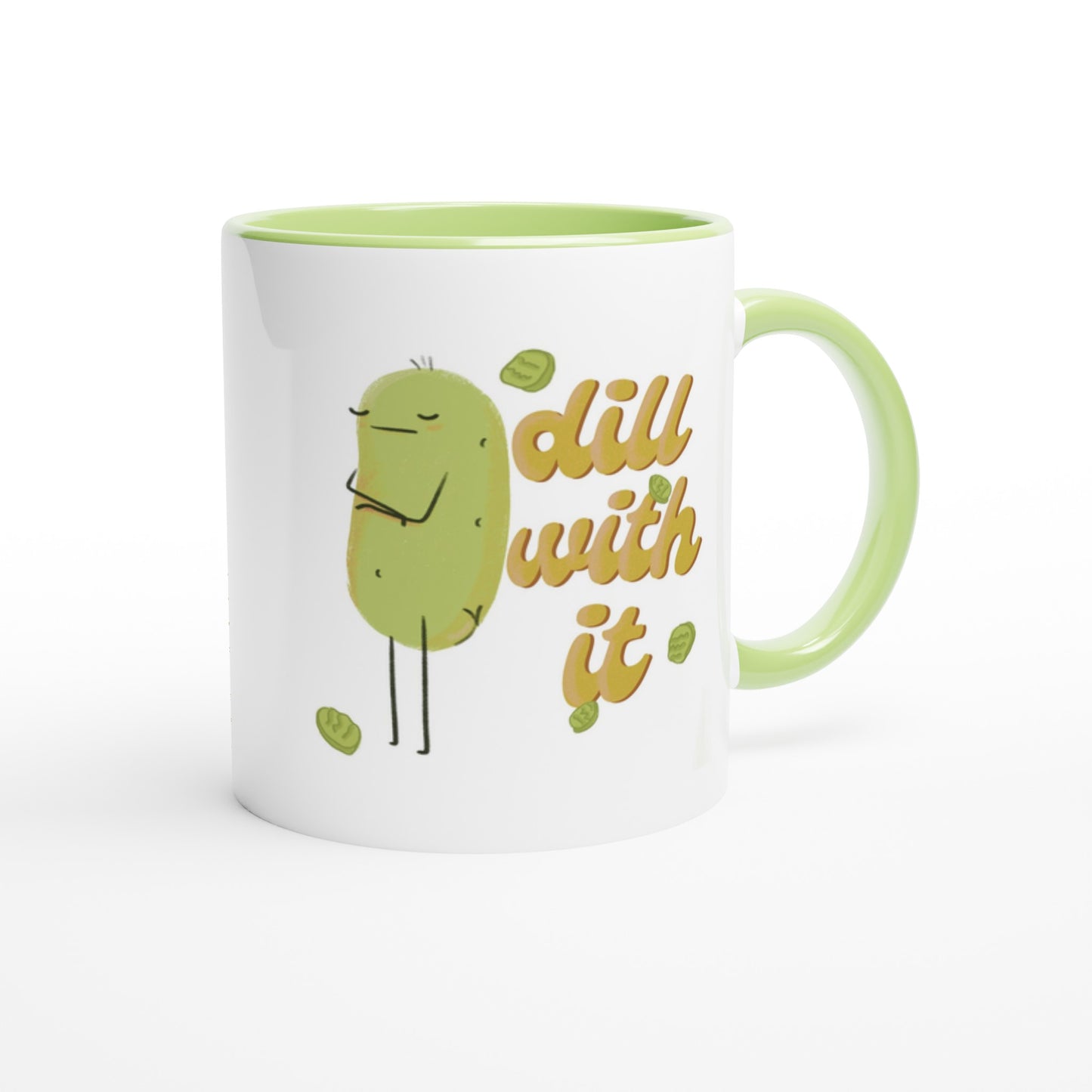 front view of a pickle mug featuring a cute illustration of a pickle character with its arms crossed next to funny text that says "dill with it" is displayed over a white background