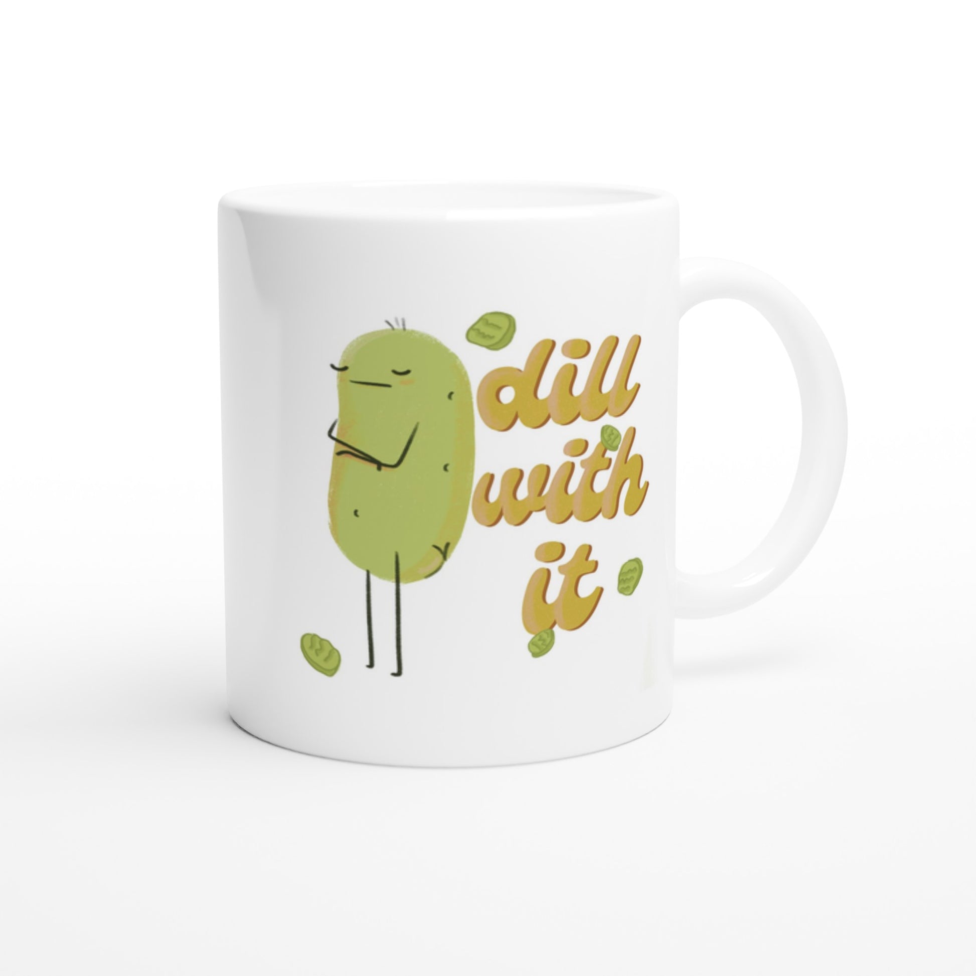 front view of a pickle mug featuring a cute illustration of a pickle character with its arms crossed next to funny text that says "dill with it" is displayed on a white background