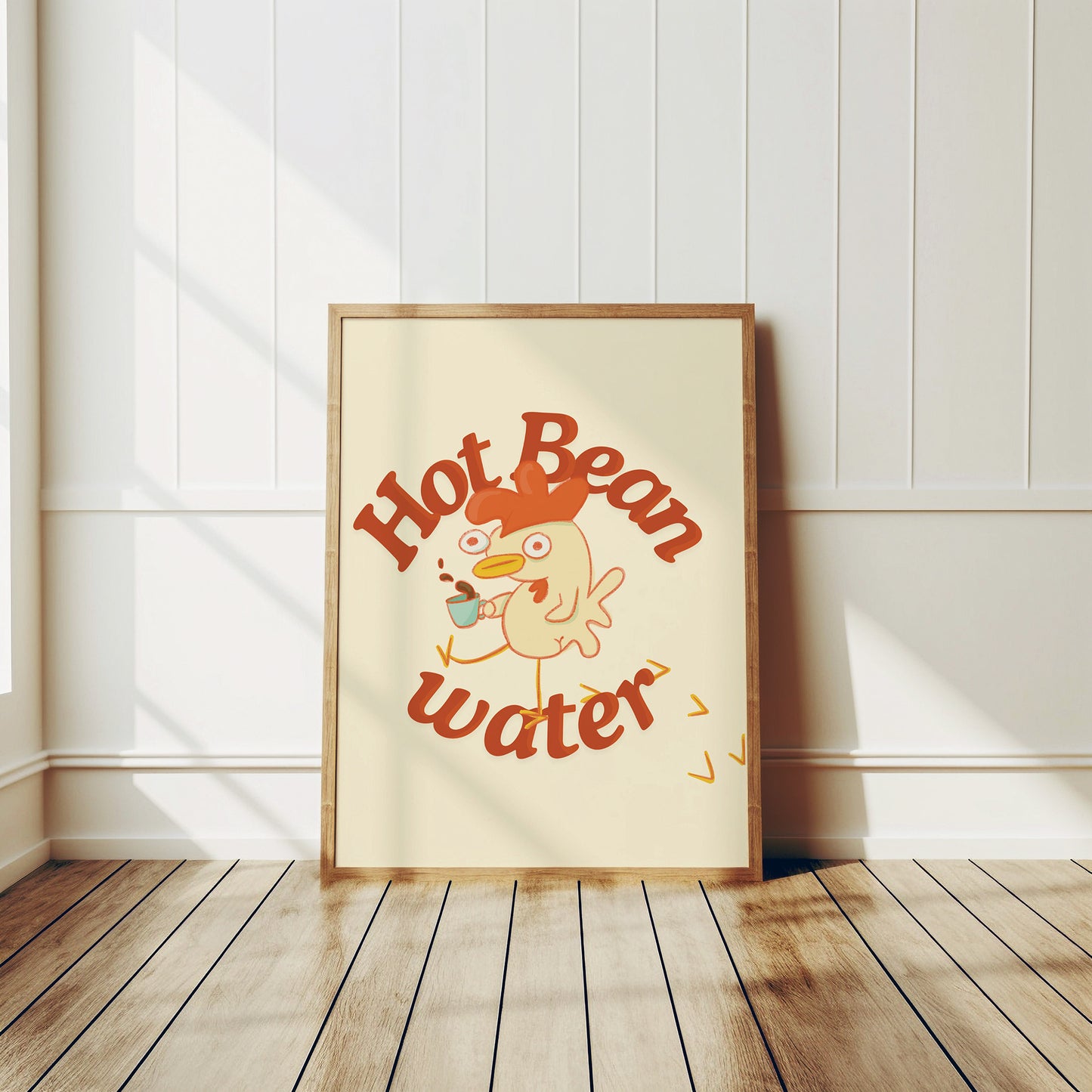 a funny coffee art print that features a chicken holding a cup of coffee next to text that reads &quot;hot bean water&quot; is displayed in a wooden frame leaning against the wall