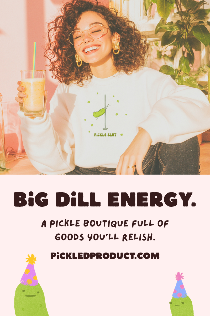 Person wearing a pickle-themed shirt with text promoting 'Big Dill Energy' and a website URL.