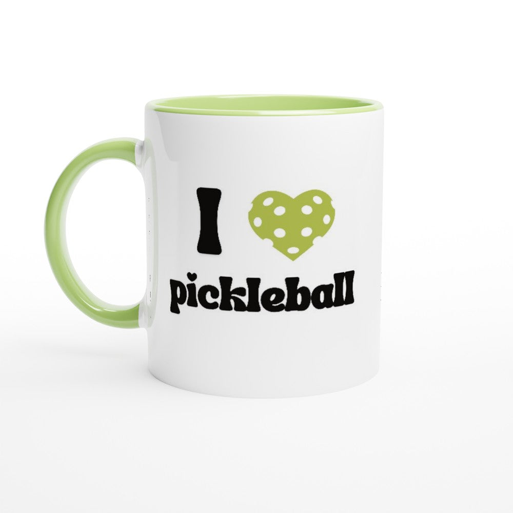 close up view of a pickleball mug with a quote that says "I heart Pickleball" with green ceramic accents