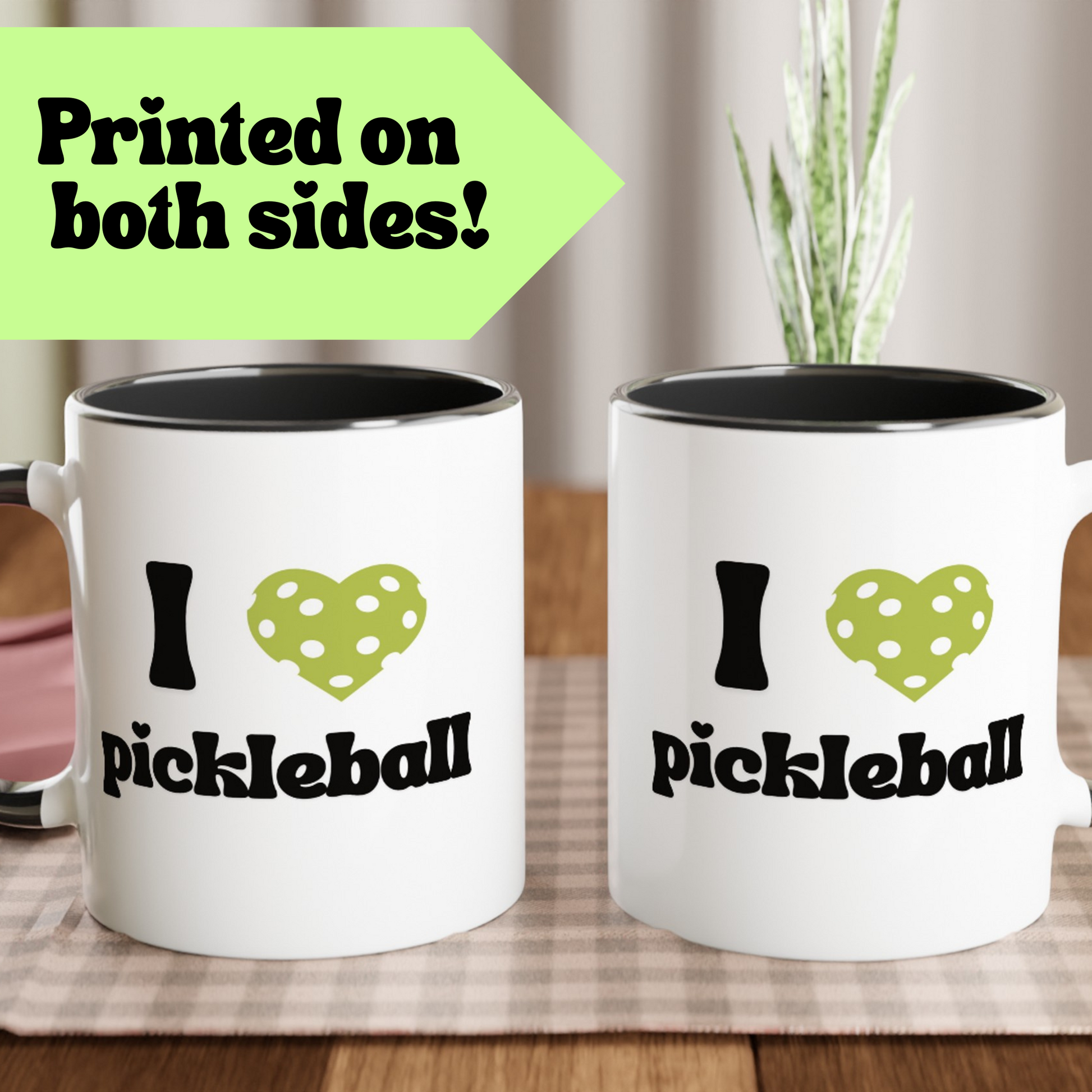 close up view of a pickle ball mug with a quote that says "I heart Pickle ball" with black ceramic accents