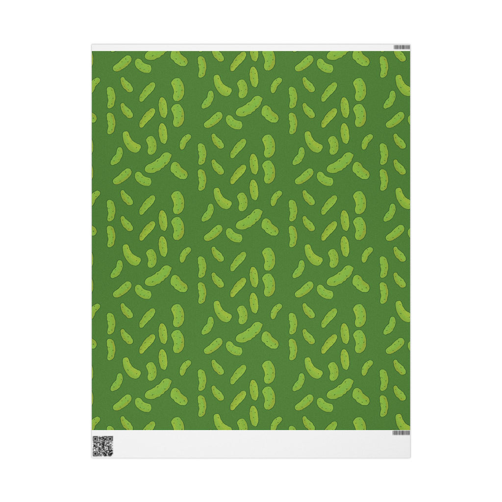 dill pickle wrapping paper that features a pattern of dill pickles over a dark green background is shown unrolled over a white background