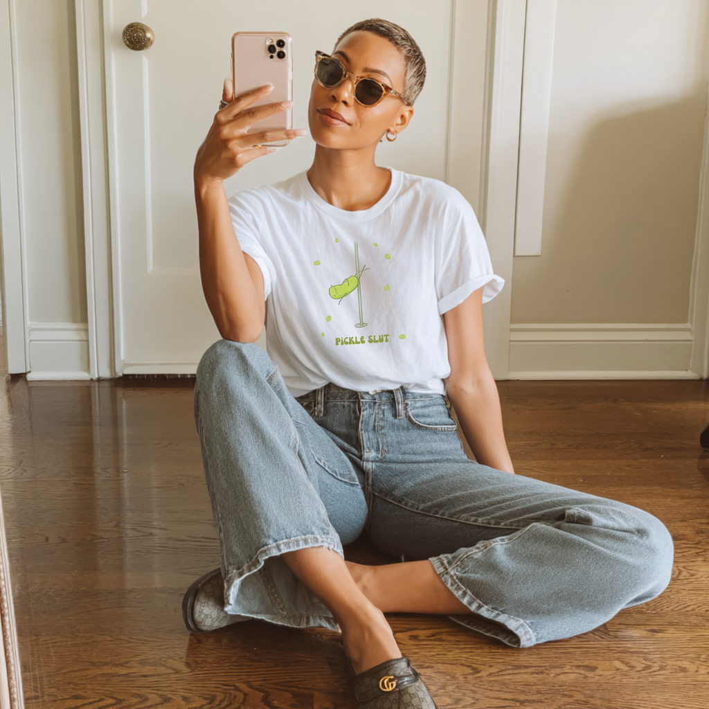 a pickle slut t-shirt is worn by a woman with a pixie style hair cut