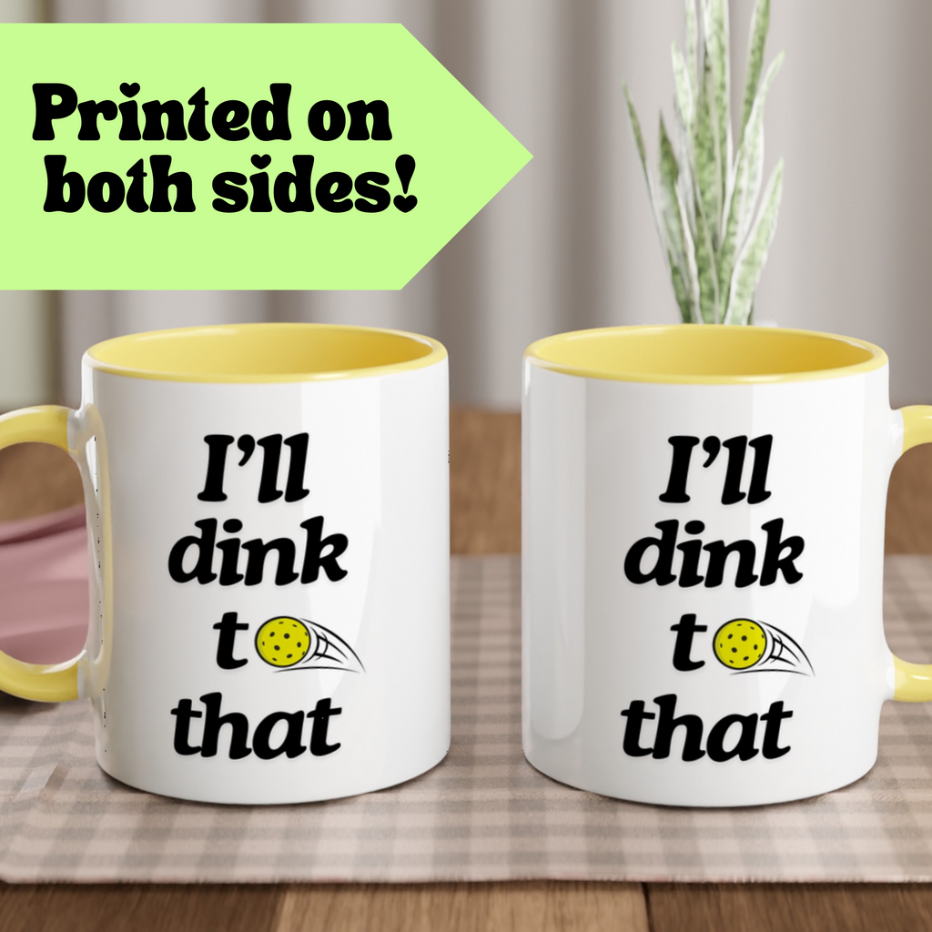 two sided view of pickle ball mug with yellow ceramic accents and funny pickle ball quote that says "I'll dink to that"