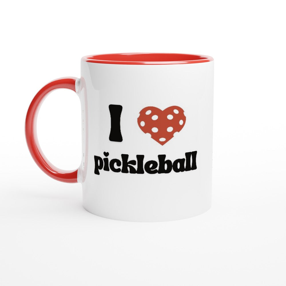 close up view of a pickle ball mug with a quote that says "I heart Pickle ball" with red ceramic accents