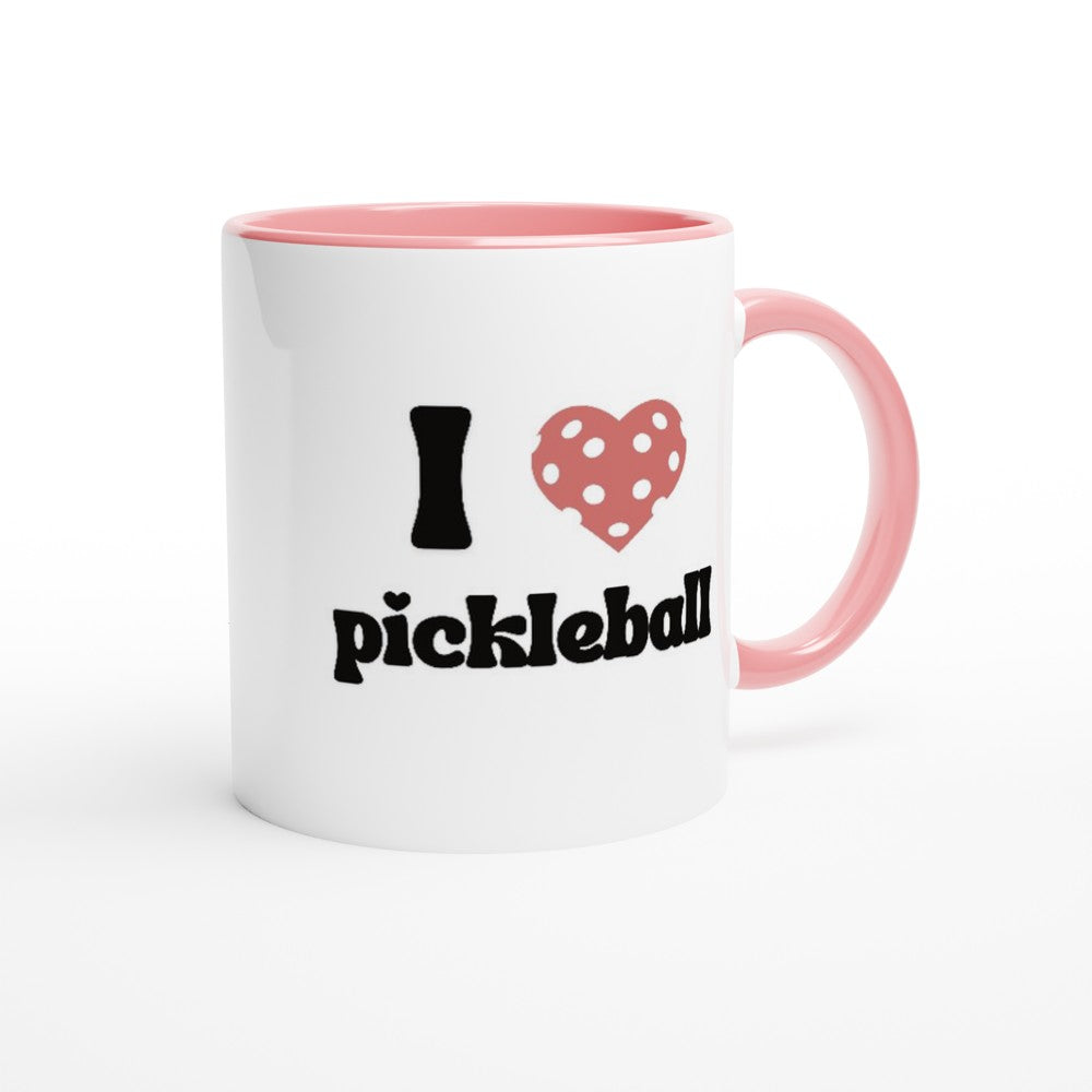 front view of a pickleball mug with a quote that says "I heart pickleball" with illustration of pink pickleball shaped heart