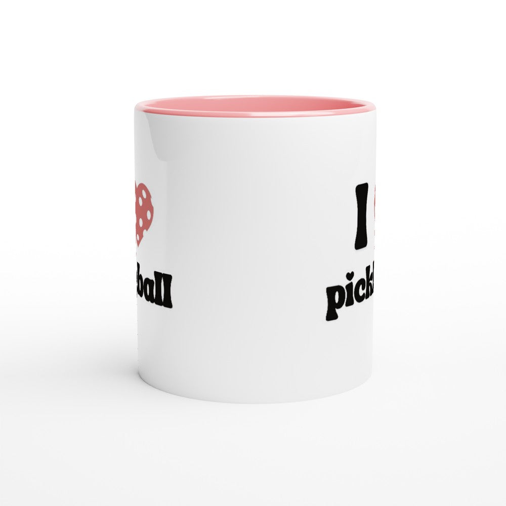 side view of a pickleball mug with a quote that says "I heart pickleball" with illustration of pink pickleball shaped heart