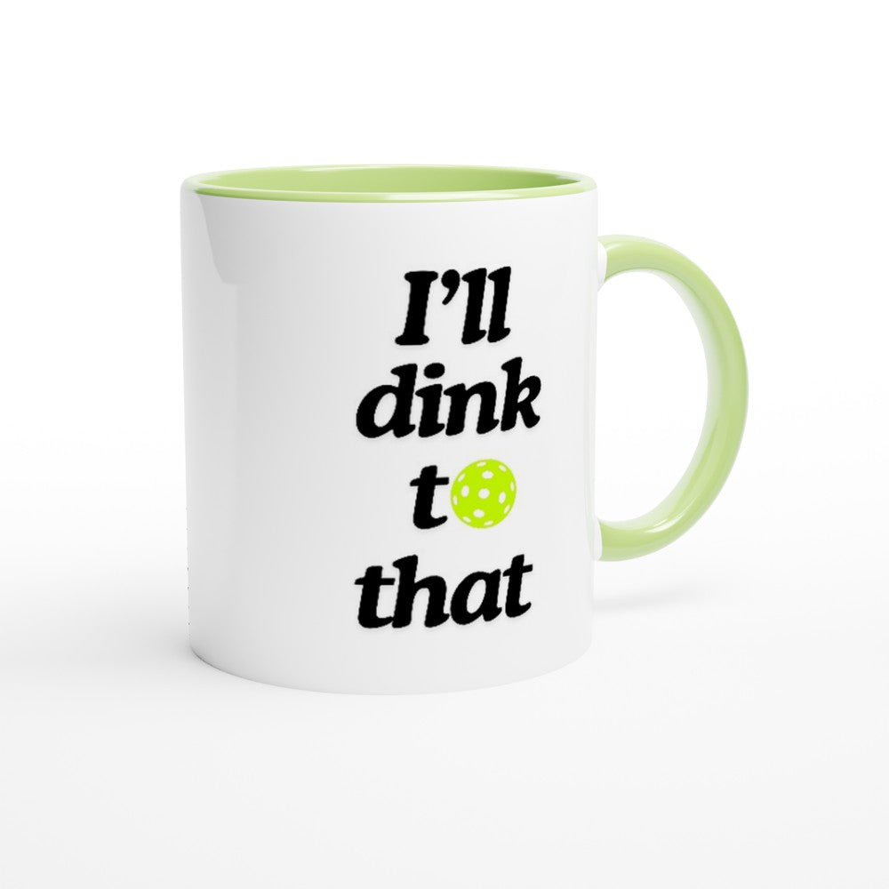 view of a pickle ball mug with a funny quote that says "I'll dink to that" with illustration of green pickle ball