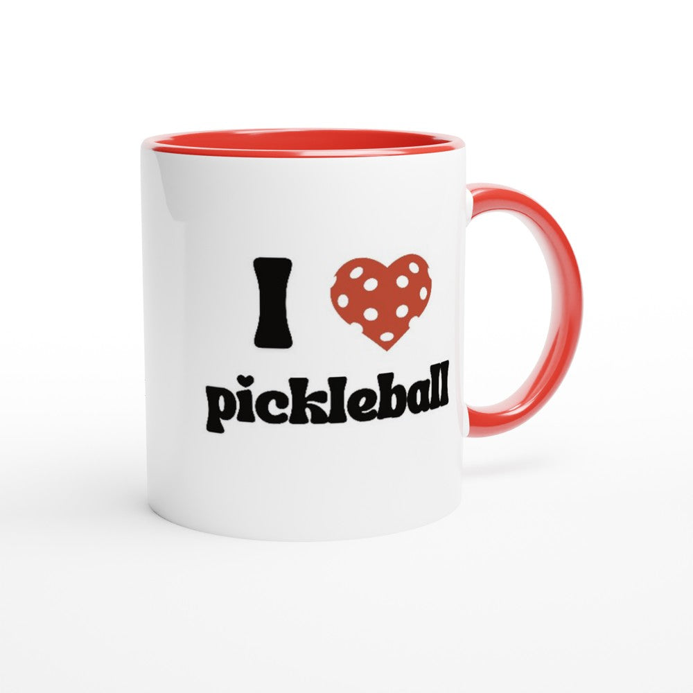 close up view of a pickle ball mug with a quote that says "I heart Pickle ball" with red ceramic accents