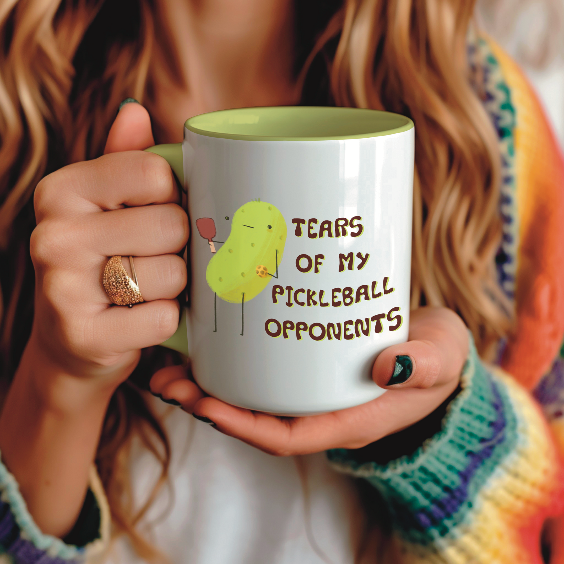 image of a woman holding a pickleball mug with funny quote that says "tears of my pickleball opponents" next to illustration of a pickle holding a pickleball and paddle