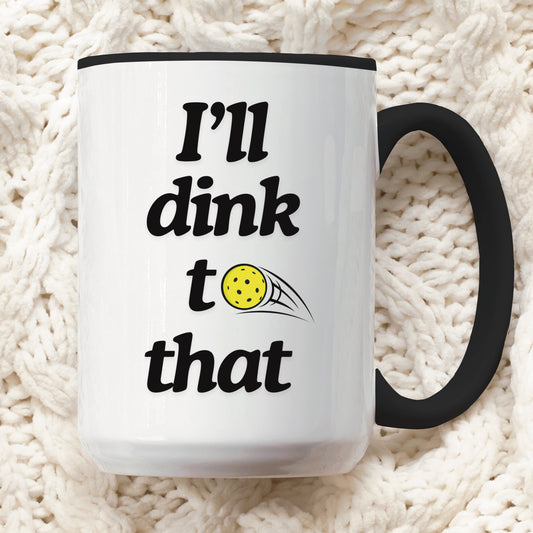 close up view of pickleball quote coffee mug with black ceramic accents and quote that says "I'll dink to that"